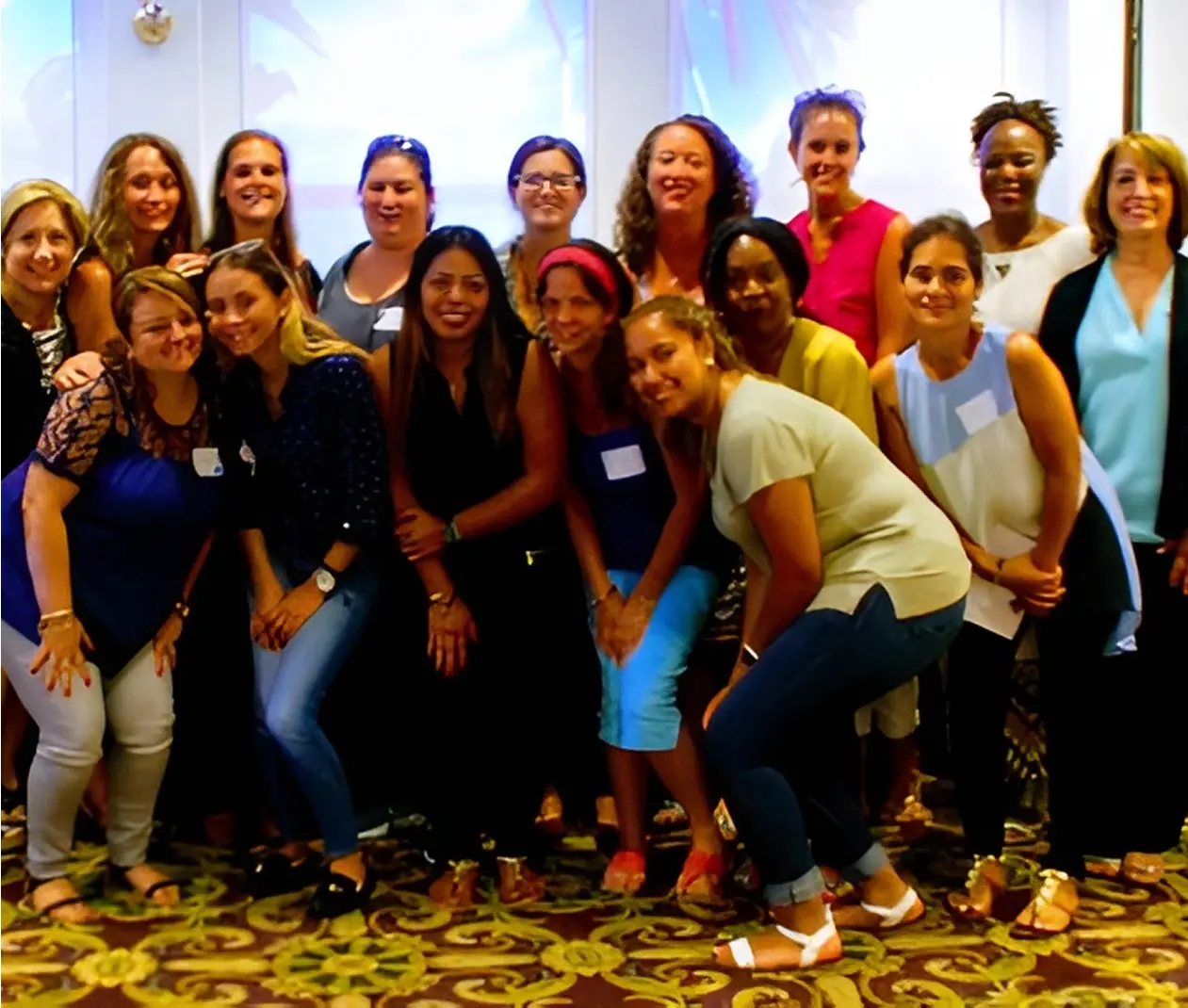 Group of women posing together indoors.