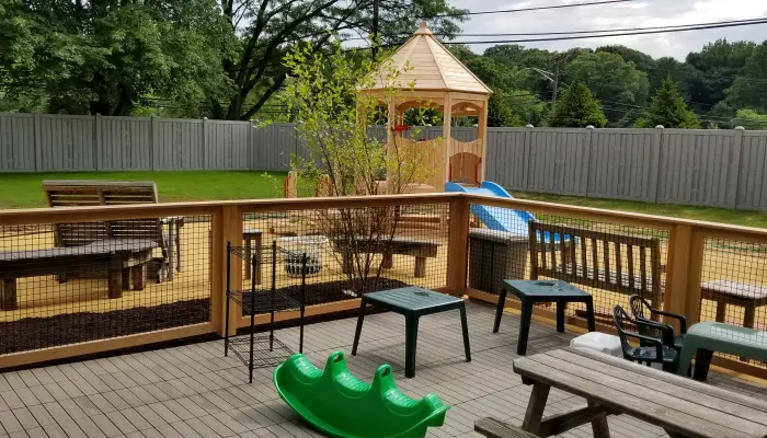 Playground with slide and seating area.