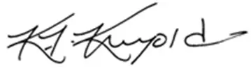 Cursive handwritten signature on white background.